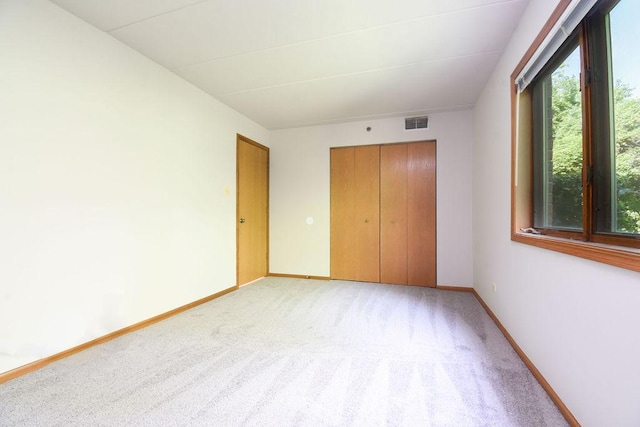 10278 SW Hwy Unit 1D, Chicago Ridge, IL 60415 - unfurnished bedroom with light carpet and a closet
