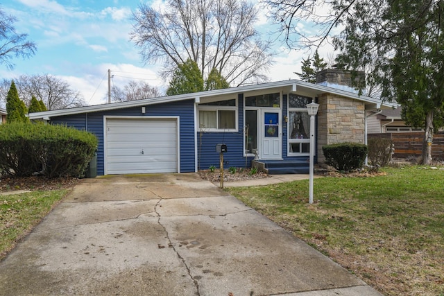 144 Crestwood Dr, East Dundee, IL 60118 - mid-century inspired home with a chimney, a garage, driveway, and stone siding