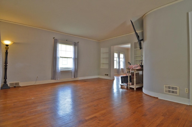 623 Marcy St, Ottawa, IL 61350 - unfurnished room with plenty of natural light, ornamental molding, and wood finished floors