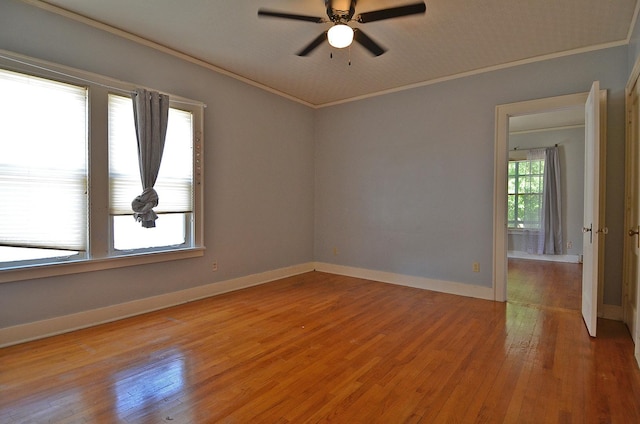 623 Marcy St, Ottawa, IL 61350 - unfurnished room with light wood finished floors, crown molding, and a ceiling fan