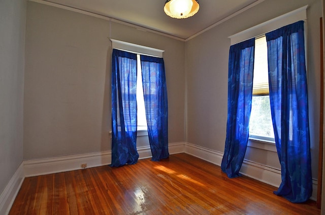623 Marcy St, Ottawa, IL 61350 - spare room featuring wood finished floors and crown molding