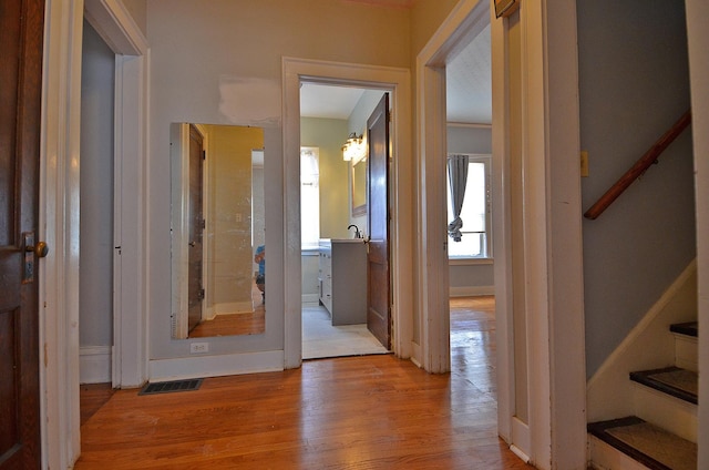 623 Marcy St, Ottawa, IL 61350 - hallway featuring light wood-style flooring and stairs