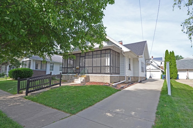 623 Marcy St, Ottawa, IL 61350 - view of front of property with a front lawn, a sunroom, and a chimney