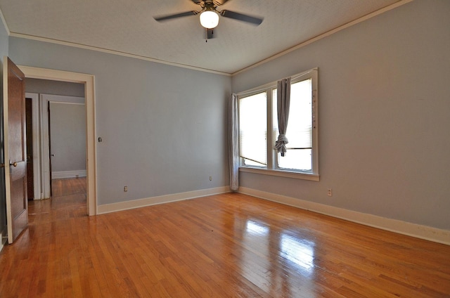 623 Marcy St, Ottawa, IL 61350 - unfurnished room featuring ornamental molding, ceiling fan, light wood finished floors, and a textured ceiling