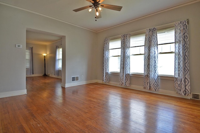 623 Marcy St, Ottawa, IL 61350 - empty room with crown molding, a ceiling fan, and wood finished floors