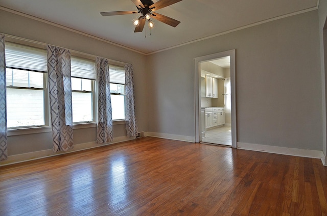 623 Marcy St, Ottawa, IL 61350 - unfurnished room featuring a ceiling fan, wood finished floors, and ornamental molding