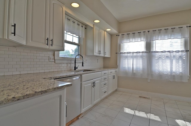623 Marcy St, Ottawa, IL 61350 - kitchen with dishwasher, decorative backsplash, white cabinetry, light stone counters, and recessed lighting