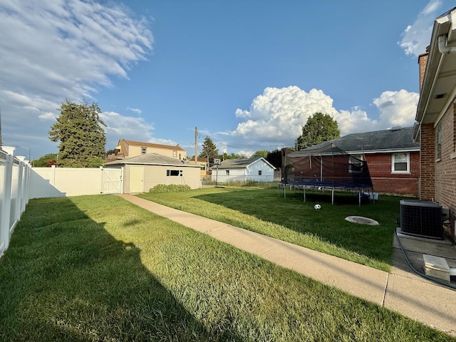 6349 N Olcott Ave, Chicago, IL 60631 - fenced backyard with a trampoline, a gate, and a residential view