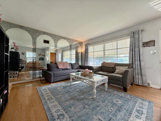 6349 N Olcott Ave, Chicago, IL 60631 - living area with arched walkways and wood finished floors