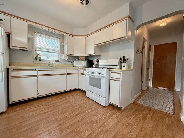 6349 N Olcott Ave, Chicago, IL 60631 - kitchen featuring white appliances, light wood finished floors, light countertops, and white cabinetry