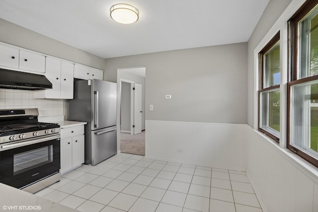 33 W Wise Rd, Schaumburg, IL 60193 - kitchen with stainless steel appliances, ventilation hood, light countertops, white cabinetry, and backsplash