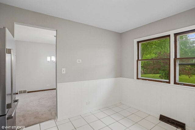 33 W Wise Rd, Schaumburg, IL 60193 - unfurnished room with a wainscoted wall
