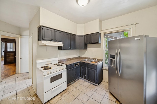 7545 S Rhodes Ave, Chicago, IL 60619 - kitchen featuring stainless steel fridge with ice dispenser, white gas range, under cabinet range hood, and light tile patterned floors
