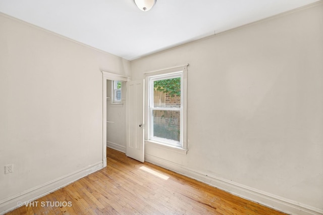 7545 S Rhodes Ave, Chicago, IL 60619 - spare room featuring light wood-style flooring and baseboards