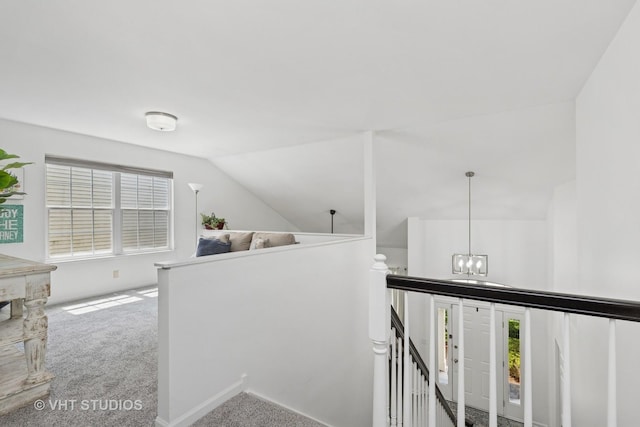 29583 N Birch Ave, Lake Bluff, IL 60044 - hallway featuring an upstairs landing, carpet, vaulted ceiling, and a chandelier