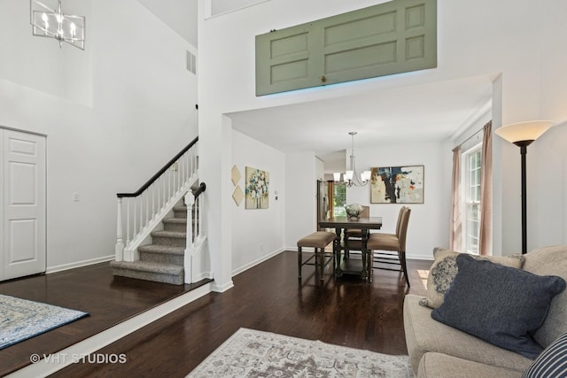 29583 N Birch Ave, Lake Bluff, IL 60044 - living area featuring a chandelier, wood finished floors, stairway, and a towering ceiling