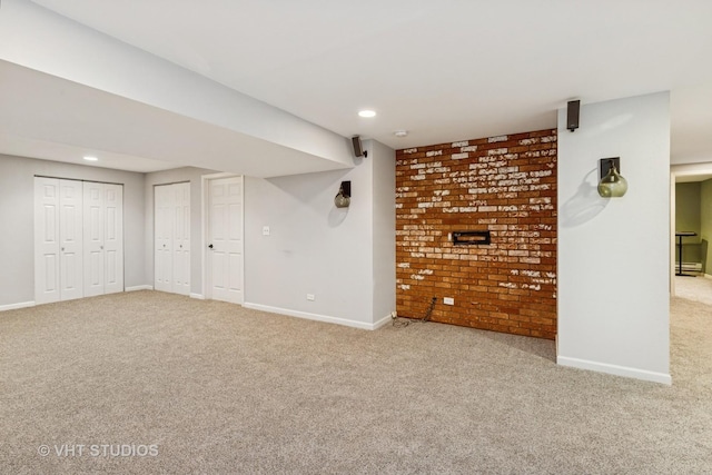29583 N Birch Ave, Lake Bluff, IL 60044 - finished below grade area with carpet flooring, recessed lighting, and brick wall