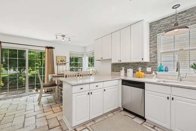 29583 N Birch Ave, Lake Bluff, IL 60044 - kitchen featuring dishwasher, a peninsula, backsplash, and white cabinets