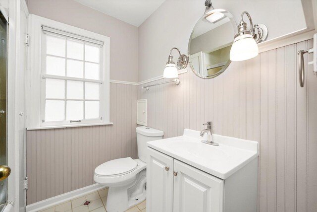 255 Irving Blvd, Chicago Heights, IL 60411 - bathroom with a wainscoted wall, vanity, and tile patterned floors