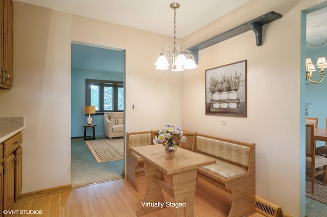 1406 Evans Ct, Elk Grove Village, IL 60007 - dining area with a chandelier, light carpet, and light wood-style flooring