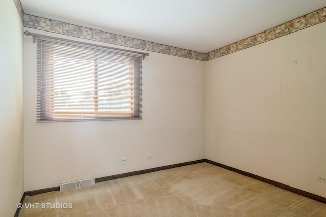 1406 Evans Ct, Elk Grove Village, IL 60007 - spare room with baseboards and light colored carpet