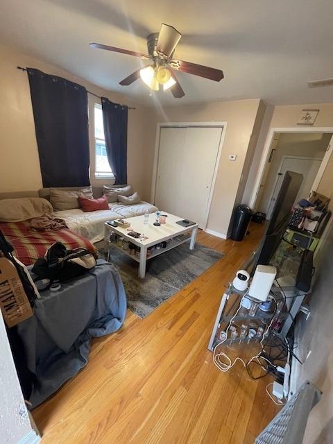 2620 W 24th St, Chicago, IL 60608 - living room with a ceiling fan and wood finished floors