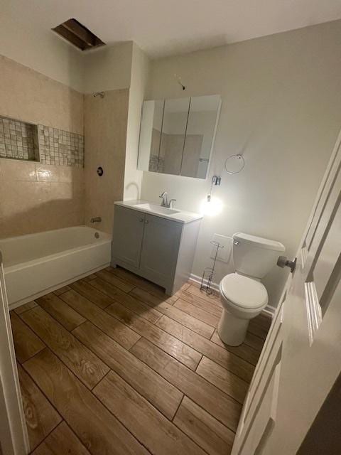2620 W 24th St, Chicago, IL 60608 - bathroom with vanity, wood finished floors, and bathing tub / shower combination
