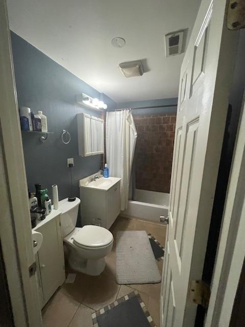 2620 W 24th St, Chicago, IL 60608 - bathroom featuring tile patterned floors, vanity, and shower / bath combination with curtain