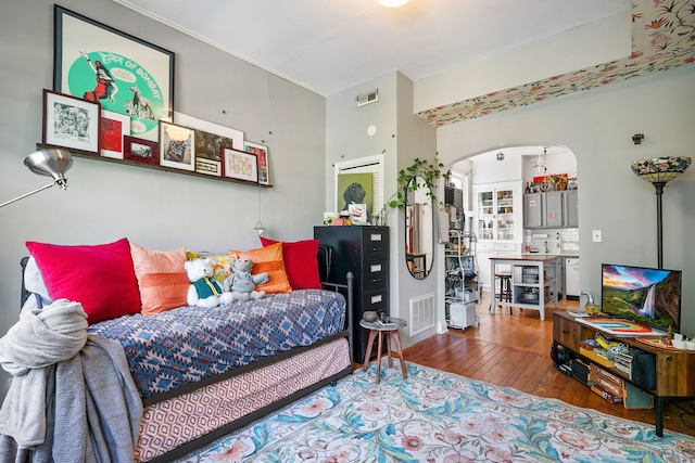 1624 N Oakley Ave, Chicago, IL 60647 - bedroom featuring arched walkways and hardwood / wood-style flooring