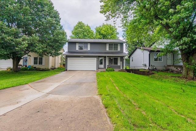 1311 Bancroft Dr, Bloomington, IL 61704 - traditional-style home featuring an attached garage, driveway, and a front yard