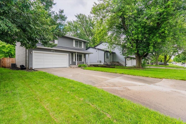 1311 Bancroft Dr, Bloomington, IL 61704 - view of front of property with concrete driveway and a garage
