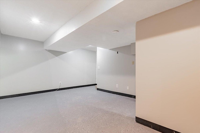 1311 Bancroft Dr, Bloomington, IL 61704 - empty room with baseboards and speckle patterned floor