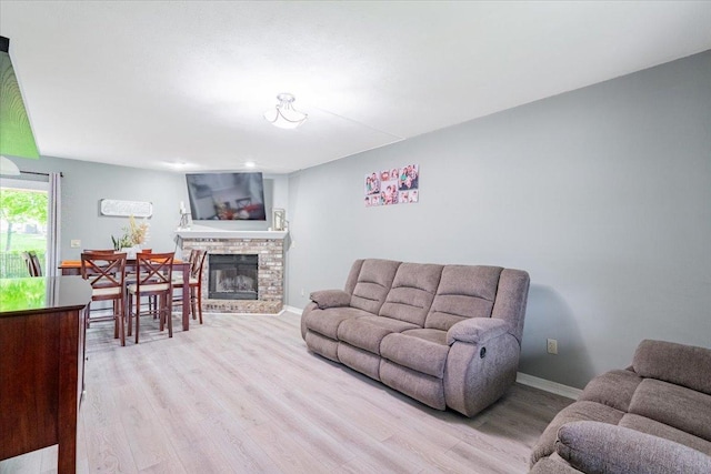 1311 Bancroft Dr, Bloomington, IL 61704 - living room featuring light wood-style flooring and a brick fireplace
