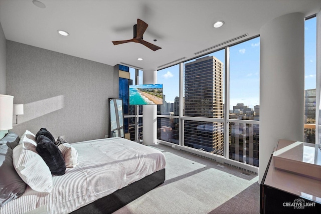 110 W Superior St Unit 1803, Chicago, IL 60654 - carpeted bedroom with floor to ceiling windows, multiple windows, a view of city, recessed lighting, and a ceiling fan