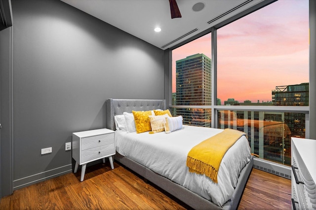 110 W Superior St Unit 1803, Chicago, IL 60654 - bedroom with wood finished floors, expansive windows, and recessed lighting