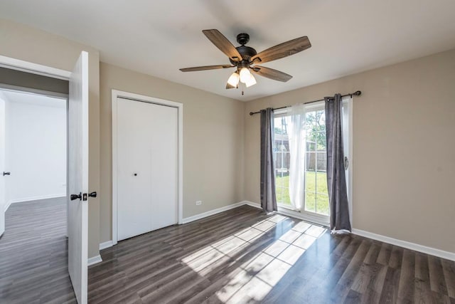 2302 Gilead Ave, Zion, IL 60099 - unfurnished bedroom with dark wood-type flooring, ceiling fan, and a closet