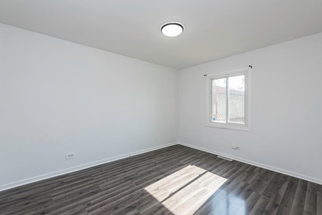 2302 Gilead Ave, Zion, IL 60099 - empty room featuring dark wood-style floors and baseboards