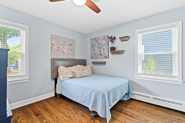 15 E Fairview St, Arlington Heights, IL 60005 - bedroom featuring baseboard heating, multiple windows, and wood finished floors