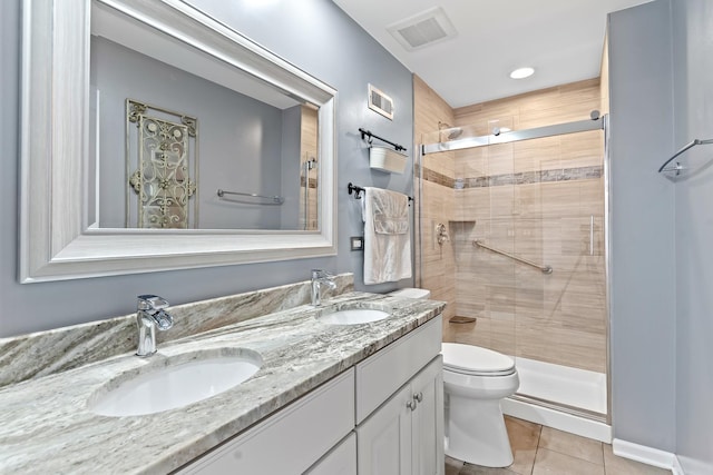 15 E Fairview St, Arlington Heights, IL 60005 - bathroom featuring tile patterned floors, double vanity, and a stall shower