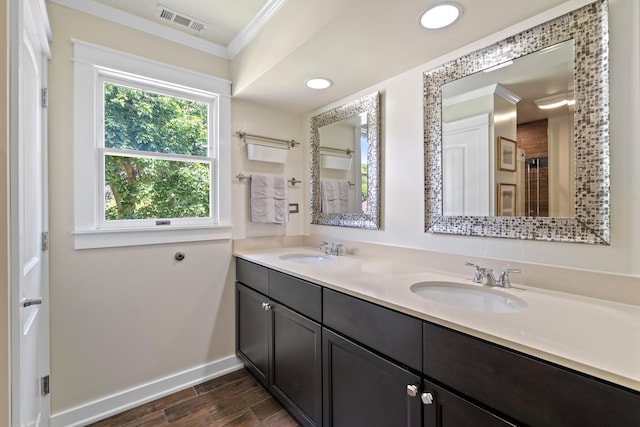 15 E Fairview St, Arlington Heights, IL 60005 - bathroom featuring ornamental molding, double vanity, wood finished floors, and recessed lighting