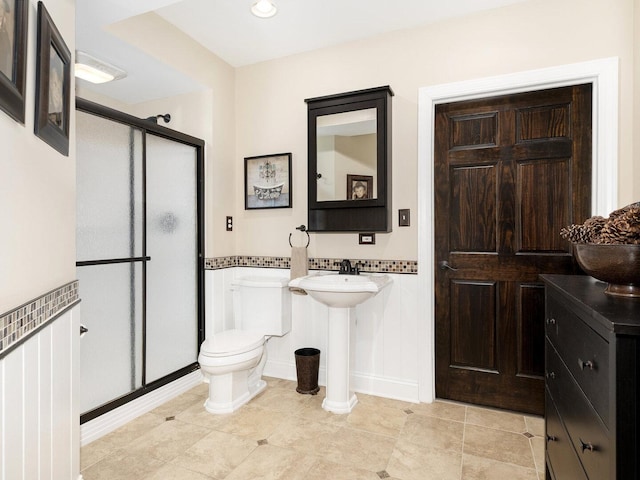 12114 W Castle Dr, Mokena, IL 60448 - full bathroom with a stall shower, tile patterned flooring, and a wainscoted wall