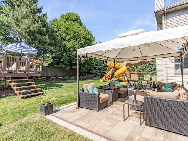 12114 W Castle Dr, Mokena, IL 60448 - fenced backyard featuring outdoor lounge area, a playground, a deck, and a patio