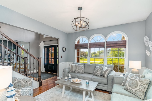 12114 W Castle Dr, Mokena, IL 60448 - living room featuring a chandelier, wood finished floors, and stairway