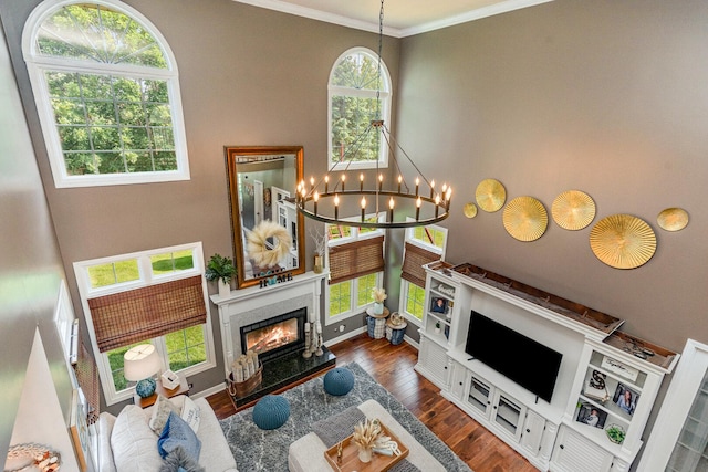 12114 W Castle Dr, Mokena, IL 60448 - living area with a chandelier, wood finished floors, a high end fireplace, and crown molding