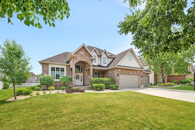 26645 W Ian Ct, Channahon, IL 60410 - traditional-style house with brick siding, driveway, a front lawn, a shingled roof, and a garage