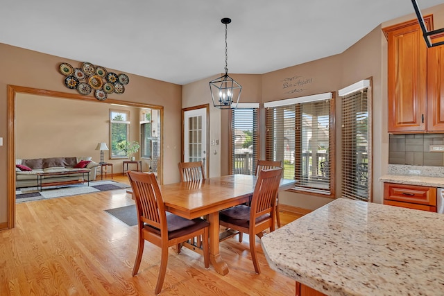 26645 W Ian Ct, Channahon, IL 60410 - dining space with light wood-style floors and a chandelier