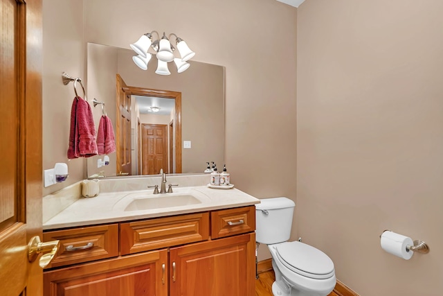 26645 W Ian Ct, Channahon, IL 60410 - bathroom featuring vanity, a chandelier, and wood finished floors