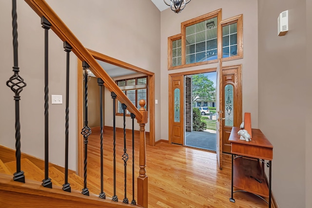 26645 W Ian Ct, Channahon, IL 60410 - entryway featuring light wood-type flooring, stairs, and a high ceiling