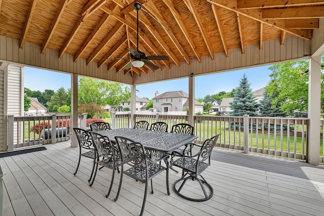 26645 W Ian Ct, Channahon, IL 60410 - wooden deck featuring outdoor dining space, ceiling fan, a residential view, and a yard