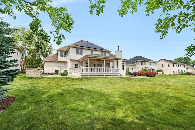 26645 W Ian Ct, Channahon, IL 60410 - rear view of house featuring a ceiling fan, a yard, solar panels, a patio area, and a deck